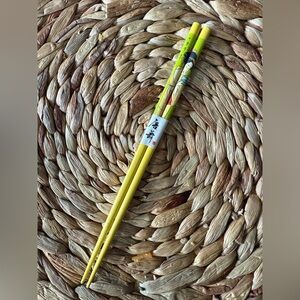 Kurashiki souvenir chopsticks decorated with a bijin-e style illustration.